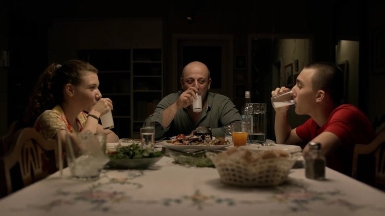 Ela and Hilmi with Ali movie backdrop